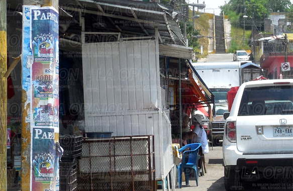 Crisis pega a los locatarios