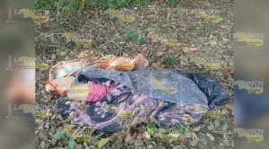 Hallan cuerpo en cobijado en camino a El Mango